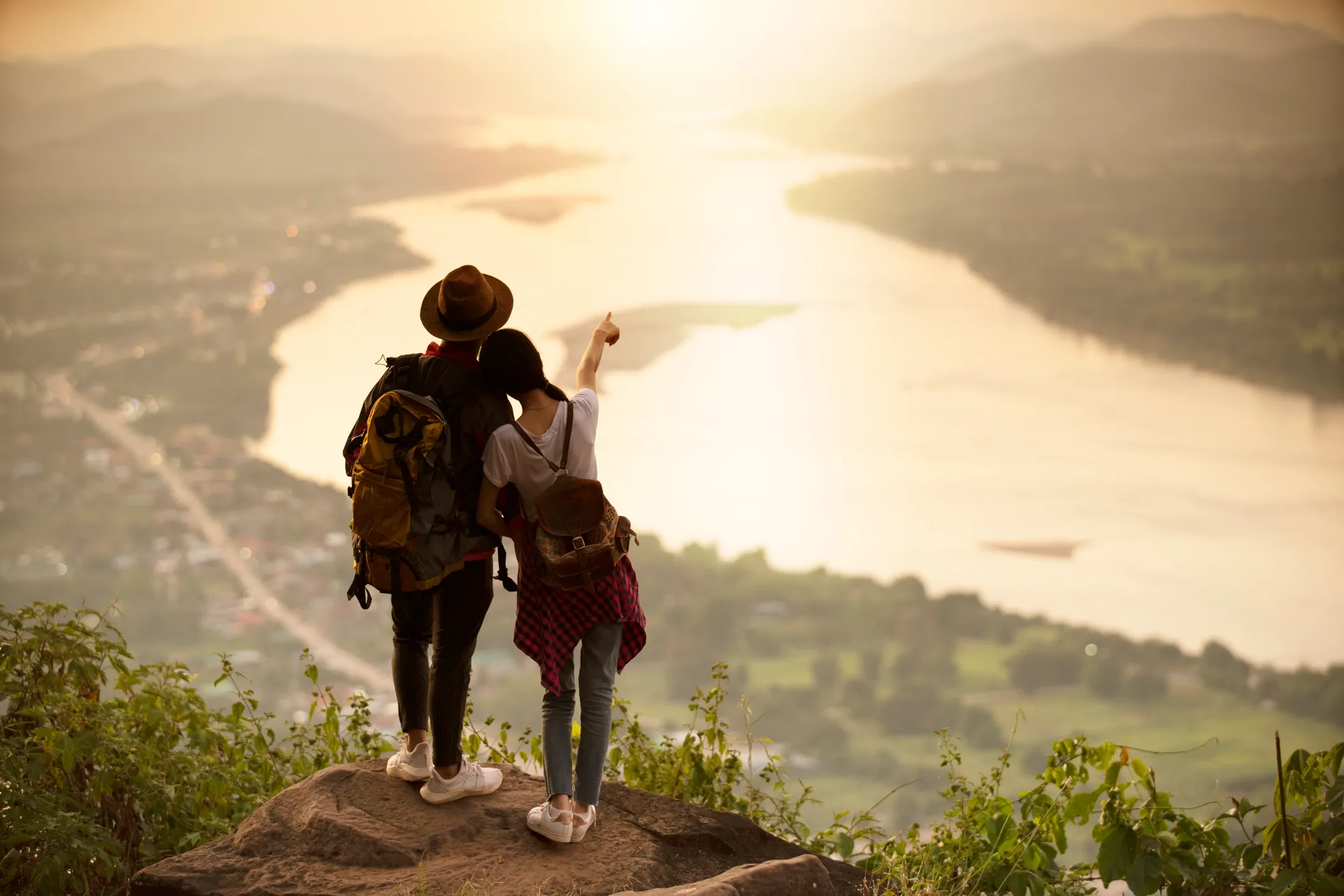 Travelers looking across a distant landscape